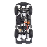 Axial 1/10 scale SCX10 III Base Camp 4x4 RTR brushed rock crawler in white, showing detailed chassis and rugged tires.