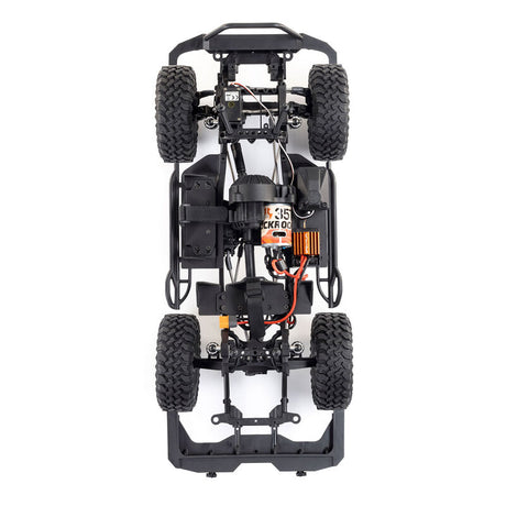 Axial 1/10 scale SCX10 III Base Camp 4x4 RTR brushed rock crawler in white, showing detailed chassis and rugged tires.