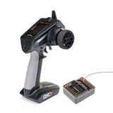 Spektrum DXC+ 12-channel DSMR transmitter with SR615 receiver, featuring multiple control sticks and display screen.