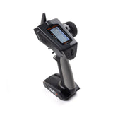 Spektrum DXC+ 12-channel DSMR+ transmitter with SR615 receiver, showing the ergonomic remote control and receiver setup.