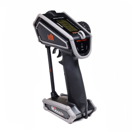 Spektrum DX Rugged+ 12-channel DSMR transmitter with SR615 receiver, shown with controls and display in a close-up view.