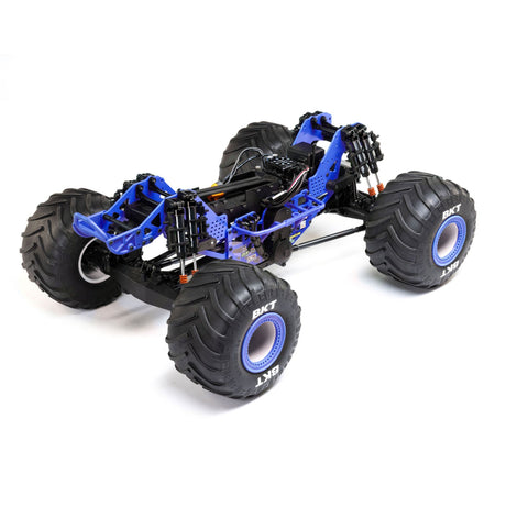Losi Son-Uva Digger LMT 2.0 1/8 scale remote control monster truck on terrain, showcasing its rugged design and large tires.