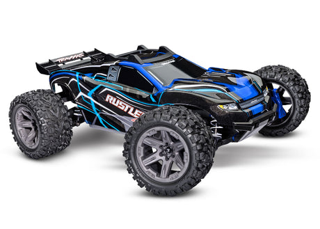 Traxxas Rustler 4X4 BL-2s radio-controlled truck shown in a dynamic action pose with detailed chassis and off-road tires.