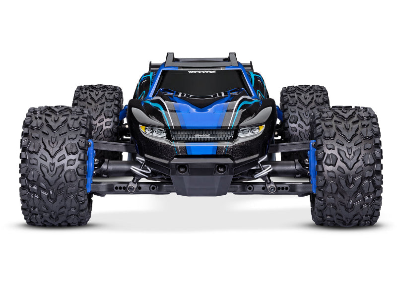 Traxxas Rustler 4X4 BL-2s remote control truck on a dirt surface, showcasing its off-road design and rugged tires.