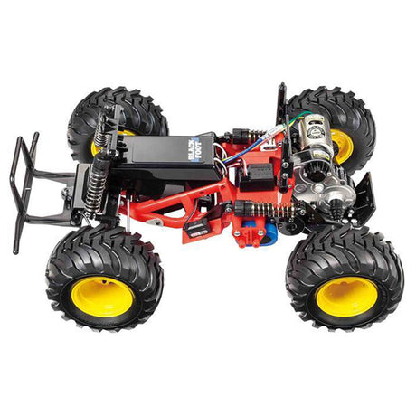 Tamiya 1/10 Blackfoot 2WD Monster Truck Kit in black, showing detailed body and large off-road tires on a white background.