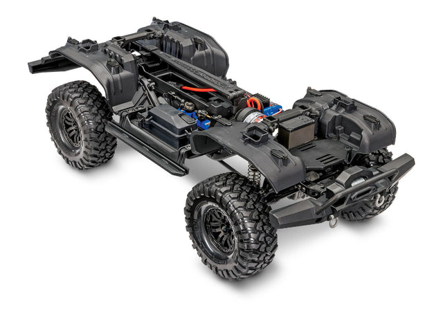 Traxxas TRX-4 crawler kit with clipless design, includes remote control, tires, and chassis for off-road RC crawling adventures.