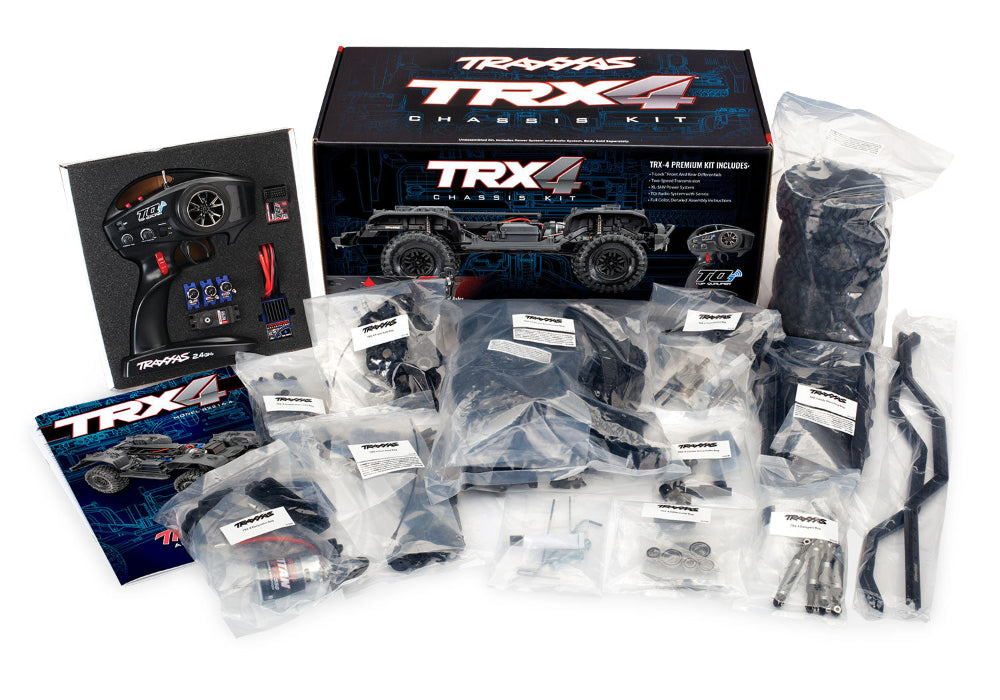 Traxxas TRX-4 Crawler Kit clipless with remote control, battery, and tools for off-road RC crawling adventures.