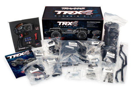 Traxxas TRX-4 Crawler Kit clipless with remote control, battery, and tools for off-road RC crawling adventures.