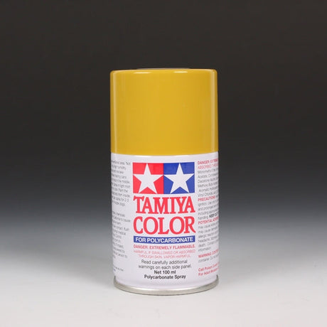 Tamiya PS-56 Mustard Yellow spray paint bottle, 100ml, with yellow paint inside and spray nozzle visible.