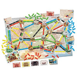 Children playing with the Ticket to Ride First Journey board game by Days of Wonder, featuring colorful game components and map.