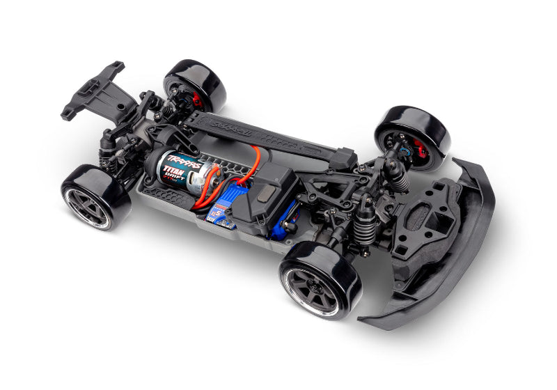 Traxxas 4-Tec Drift Ford Mustang RC car shown on a track, featuring detailed exterior and realistic drift design.