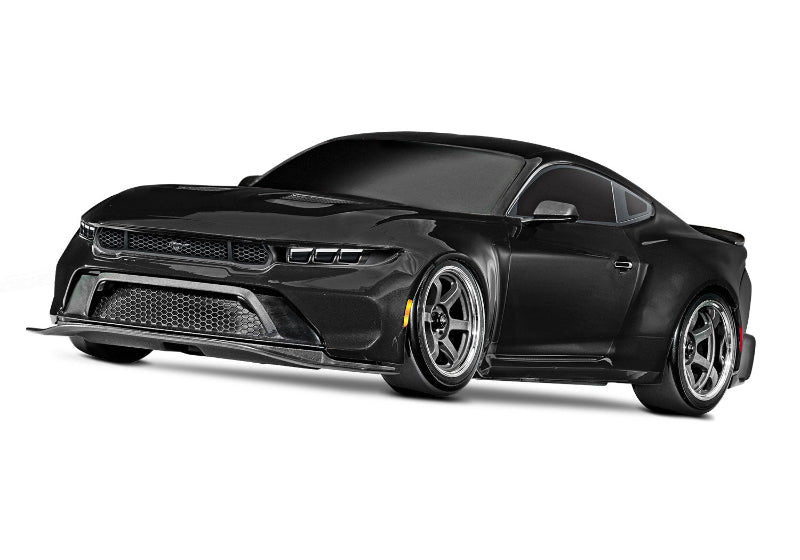 Black Traxxas 4-Tec Drift Ford Mustang radio-controlled car on a smooth surface.