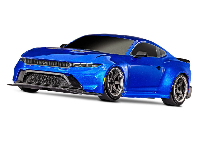 Blue Traxxas 4-Tec Drift Ford Mustang radio-controlled car on a track, showcasing its sleek design and detailed exterior.