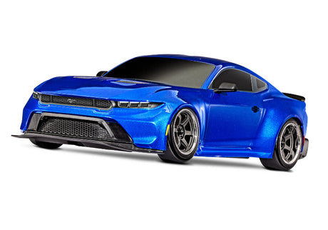 Blue Traxxas 4-Tec Drift Ford Mustang radio-controlled car on a track, showcasing its sleek design and detailed exterior.