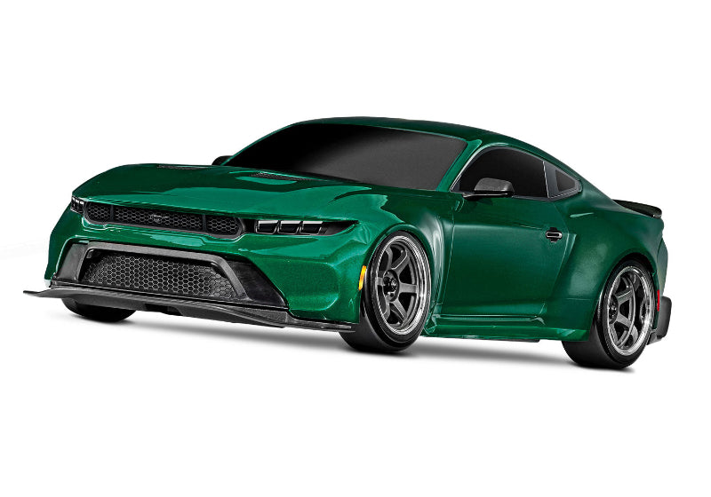 Green Traxxas 4-Tec Drift Ford Mustang RC car shown on a racetrack with detailed body and drifting tires.