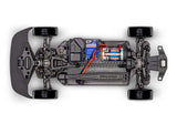 Traxxas 4-Tec Drift Nissan 240SX radio-controlled car on a track, showcasing its detailed exterior and sleek design.