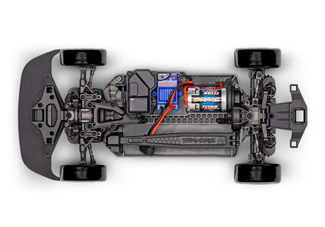 Traxxas 4-Tec Drift Nissan 240SX radio-controlled car on a track, showcasing its detailed exterior and sleek design.
