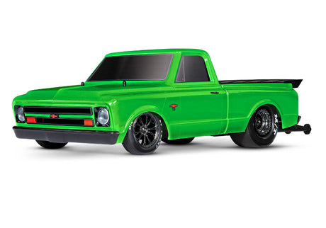 Green Traxxas Drag Slash C10 HD RC truck with detailed body and large tires, designed for high-speed drag racing.