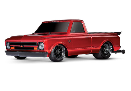 Red Traxxas Drag Slash C10 HD RC truck with detailed body and large tires, designed for high-speed drag racing.