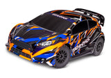 Traxxas Ford Fiesta ST Rally VXL remote control car on a track with detailed exterior and rally-inspired design.