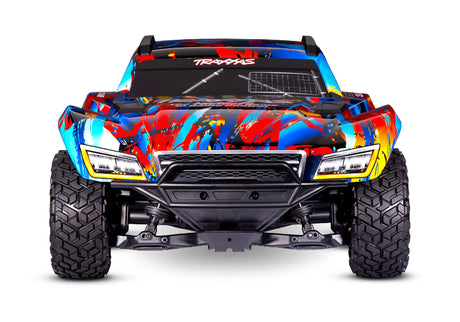Traxxas Maxx Slash 6s remote control monster truck with large tires and vibrant red and black body, ready for off-road racing.