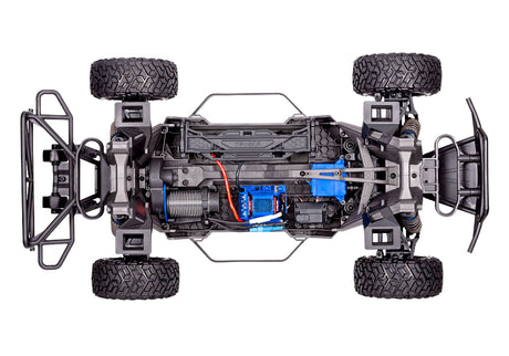 Traxxas Maxx Slash 6S RC truck with large off-road tires and sleek black and red body, ready for high-speed off-road racing.