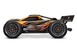 Orange Traxxas XRT 8S RC monster truck with rugged tires and detailed body, designed for off-road racing and extreme durability.