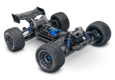 Orange Traxxas XRT 8S RC truck with rugged tires and detailed body, designed for high-performance off-road driving.