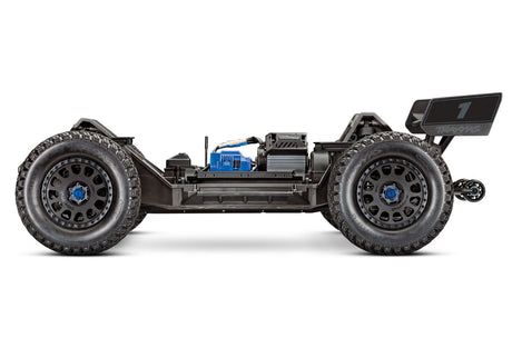 Orange Traxxas XRT 8S radio-controlled monster truck with large tires and detailed body in a dynamic outdoor setting.