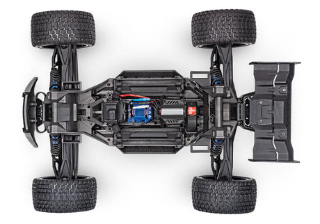 Orange Traxxas XRT 8S remote control monster truck with large tires and detailed body design.
