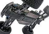 Orange Traxxas XRT 8S remote control monster truck with rugged tires and detailed body, designed for off-road performance.