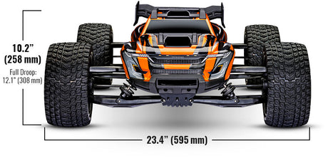 Orange Traxxas XRT 8S RC truck parked outdoors on a dirt trail, showcasing its rugged off-road design and large tires.