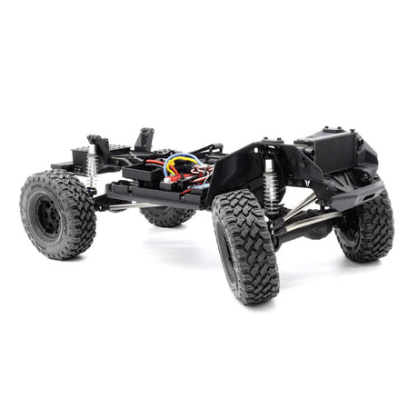 Vanquish VS4-10 Phoenix RTR remote control truck with black chassis, detailed body, and rugged tires for off-road driving.