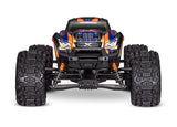 Bright yellow Traxxas X-Maxx 8s RC monster truck with large tires and detailed suspension in a dynamic outdoor setting.