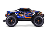 Traxxas X-Maxx 8s belted monster truck with large tires and vibrant orange body, ready for off-road racing.