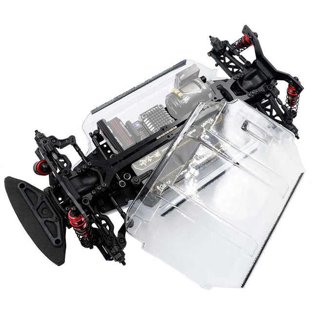 Xpress Arrow AT1SR 1/10 scale 4WD shaft drive sport rally car on track, showcasing detailed chassis and off-road tires.