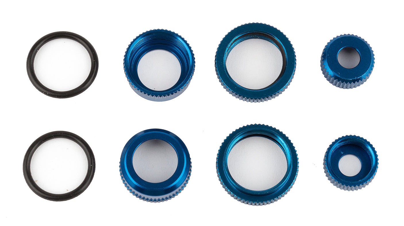 Team Associated Reflex 14 aluminum shock caps and collars with blue accents for RC car suspension.