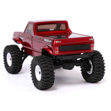 Redcat Ascent-18 off-road RC crawler with red body and rugged tires, ready for outdoor adventures.