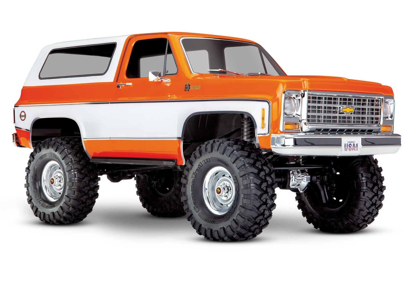 Orange Traxxas TRX-4 1979 Chevrolet Blazer radio-controlled scale model in a studio setting.