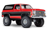 Red Traxxas TRX-4 1979 Chevrolet Blazer radio-controlled scale truck viewed from a three-quarter angle.