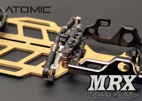 Atomic RC MRX Master vertical side spring conversion kit for RC cars, featuring black and silver components.