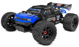 Team Corally Punisher 4S RTR monster truck featuring large tires, rugged design, and bright red body on a dirt track.