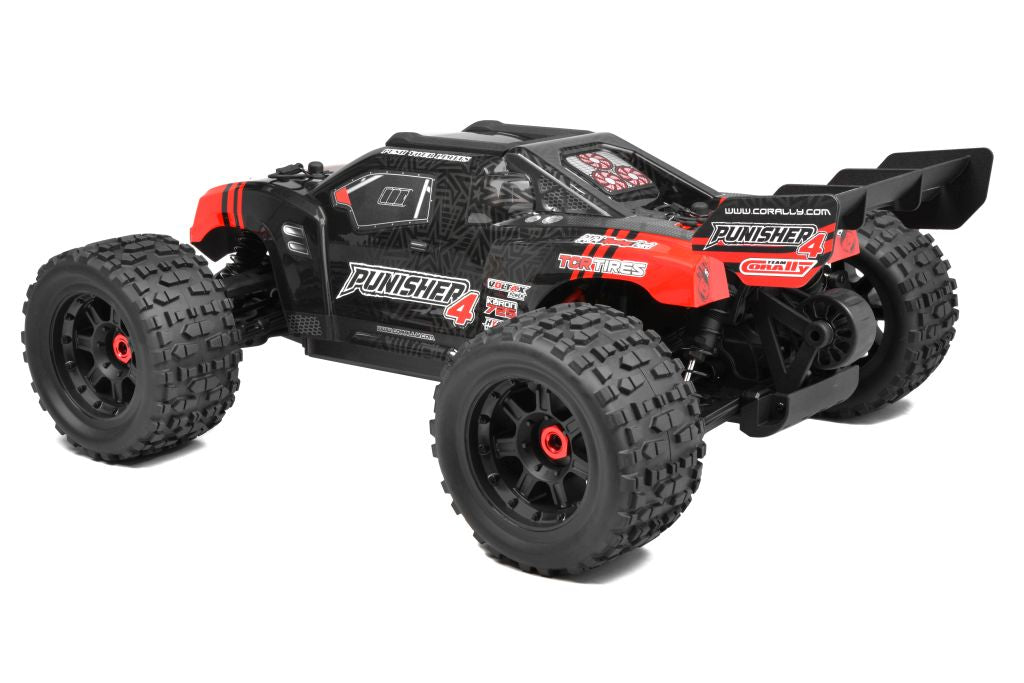 Team Corally Punisher 4S RTR monster truck with large off-road tires and vibrant paint, ready for rugged outdoor driving.