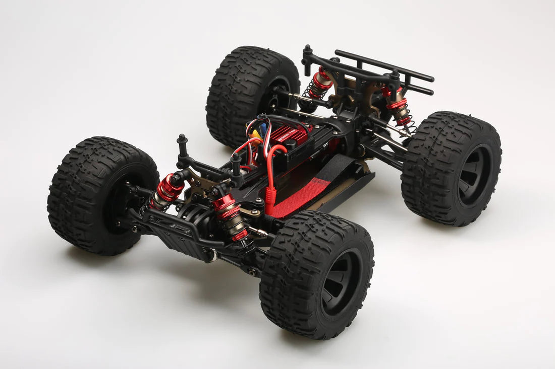 LC Racing EMB-MT 1/14 scale 4WD RTR monster truck with rugged tires and detailed body in a dynamic off-road setting