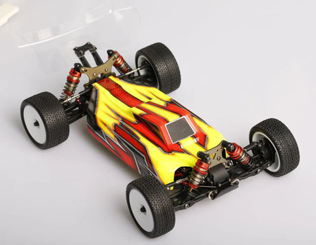 LC Racing LC12B1-HK 1/12 scale 4WD competition buggy kit with motor and ESC, shown assembled with detailed chassis and suspension.