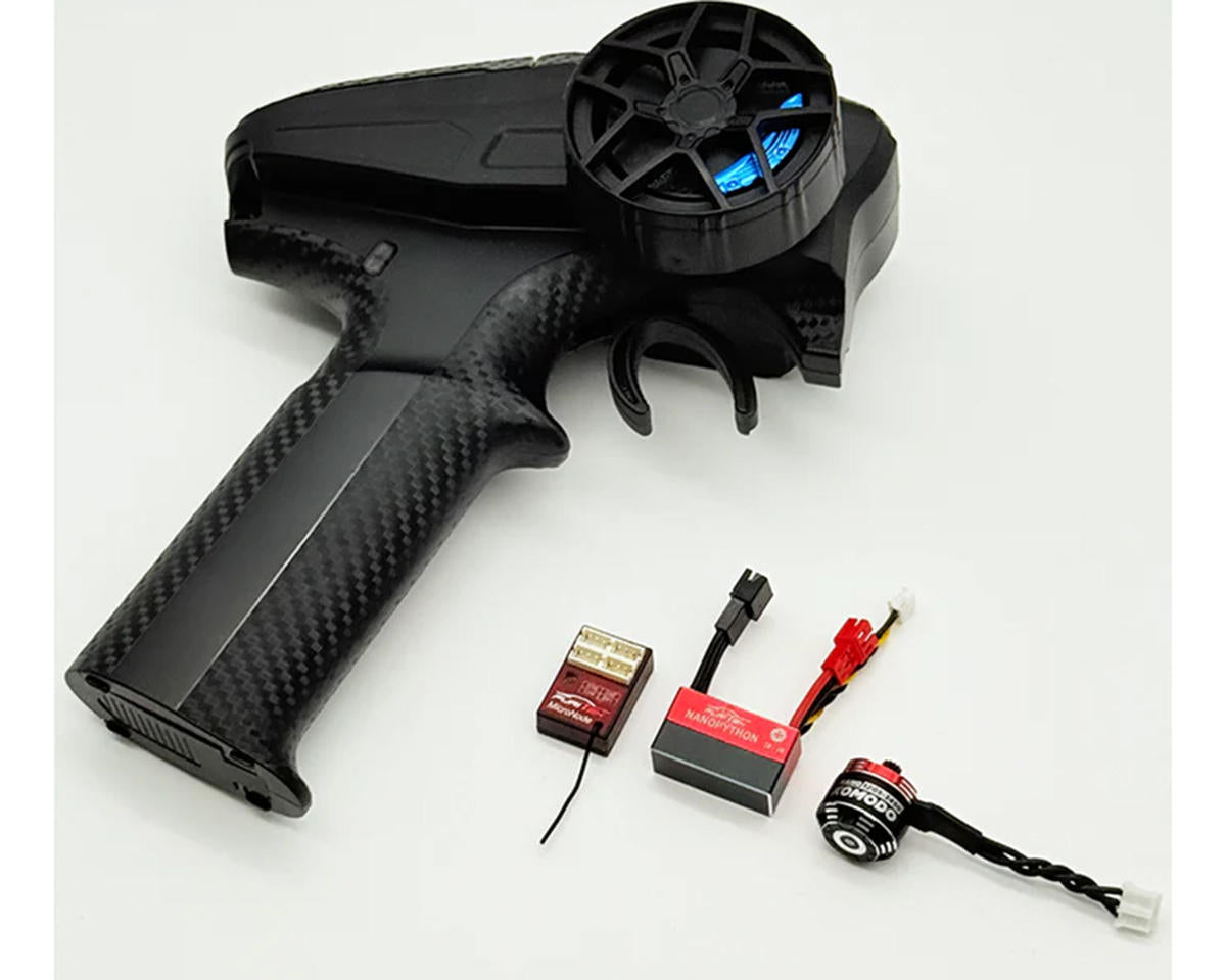 Furitek Axial SCX30 NanoModo 2026 brushless control system installed in a remote-controlled vehicle, showing electronic components and wiring.