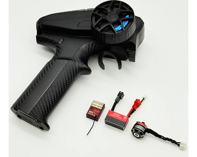 Furitek Axial SCX30 NanoModo 2026 brushless control system installed in a remote-controlled vehicle, showing electronic components and wiring.