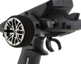 Futaba 4PM Plus 4-channel 2.4GHz T-FHSS radio system transmitter with control sticks and display screen.