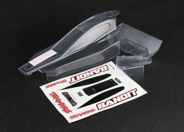 Traxxas Bandit clear RC car body with wing, lightweight plastic shell for remote control racing vehicles.