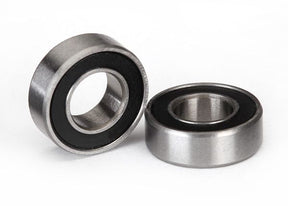Pair of black 6x12x4mm Traxxas ball bearings with seals, ideal for RC car maintenance and performance upgrades.